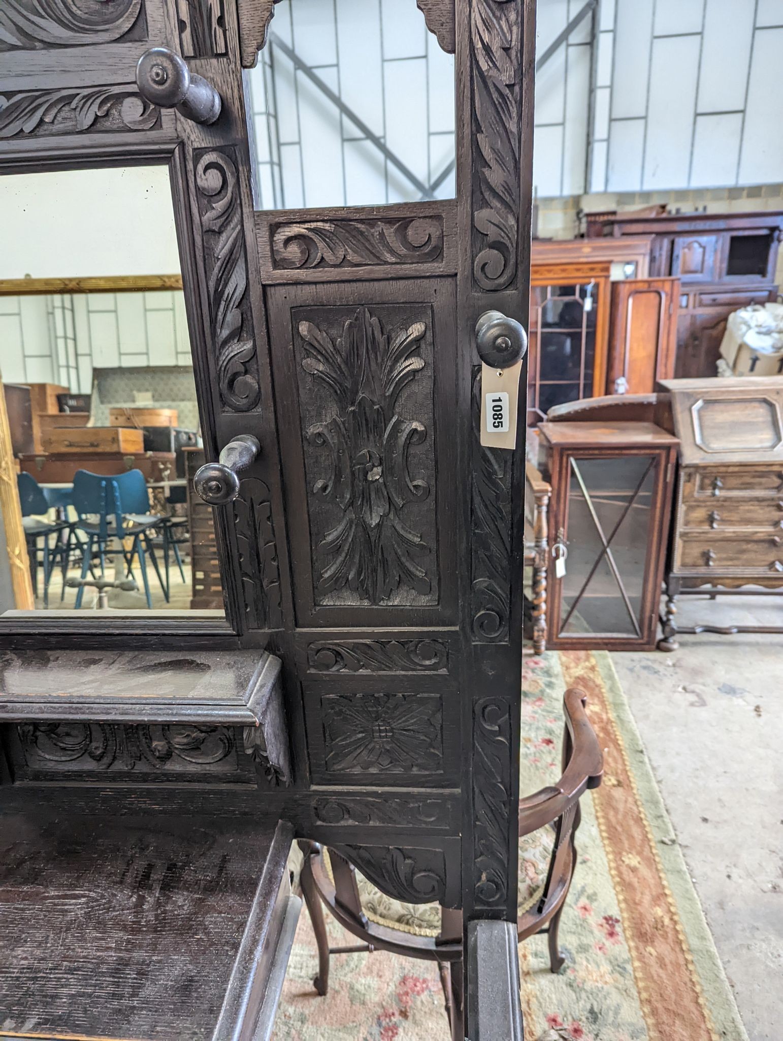 A late Victorian carved oak hall stand, width 102cm, depth 34cm, height 188cm